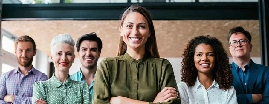 Diverse group of candidates smiling in a row